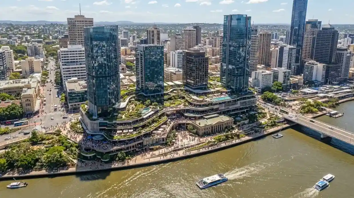 Aerial view of the Queen's Wharf Brisbane precinct spanning 12 hectares along the riverfront with four hotel towers rising above William Street